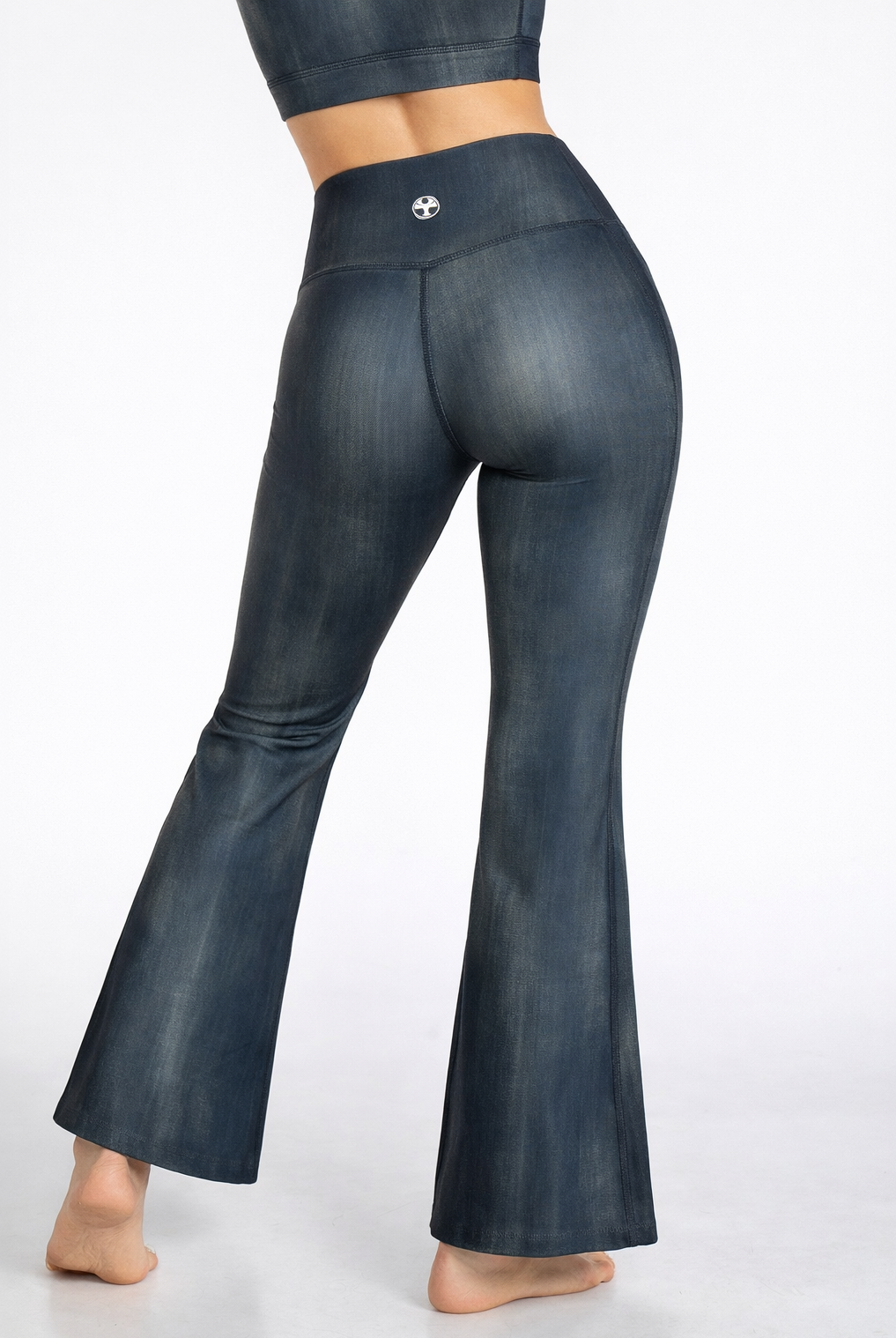 Dark blue flared pants on a white background