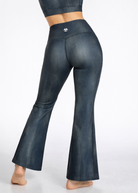 Dark blue flared pants on a white background